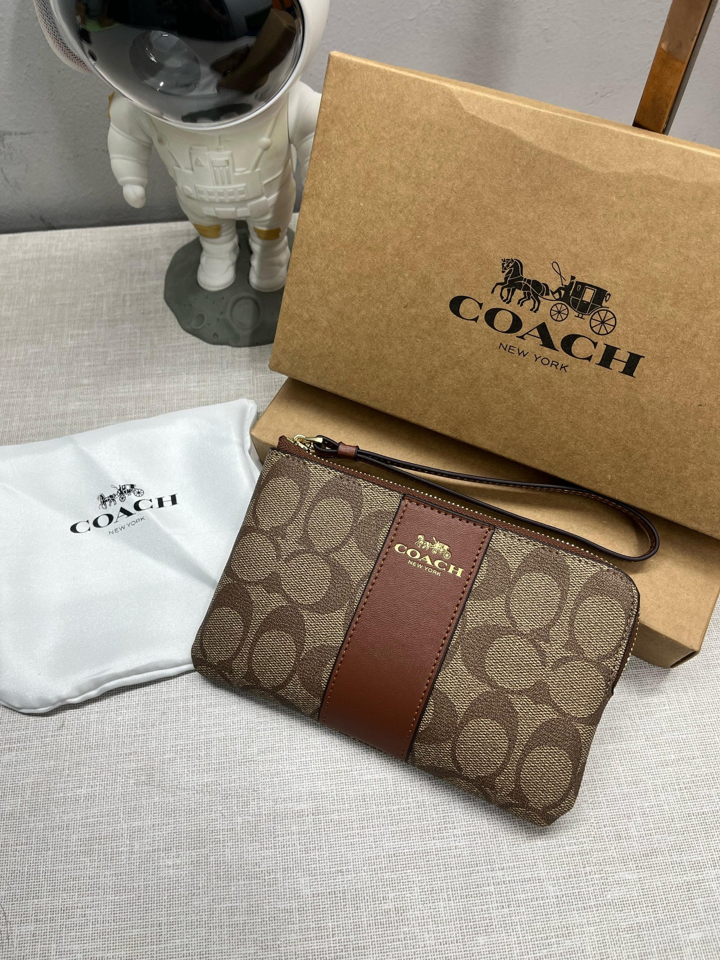 Coach Corner Zip Wristlet In Signature Canvas