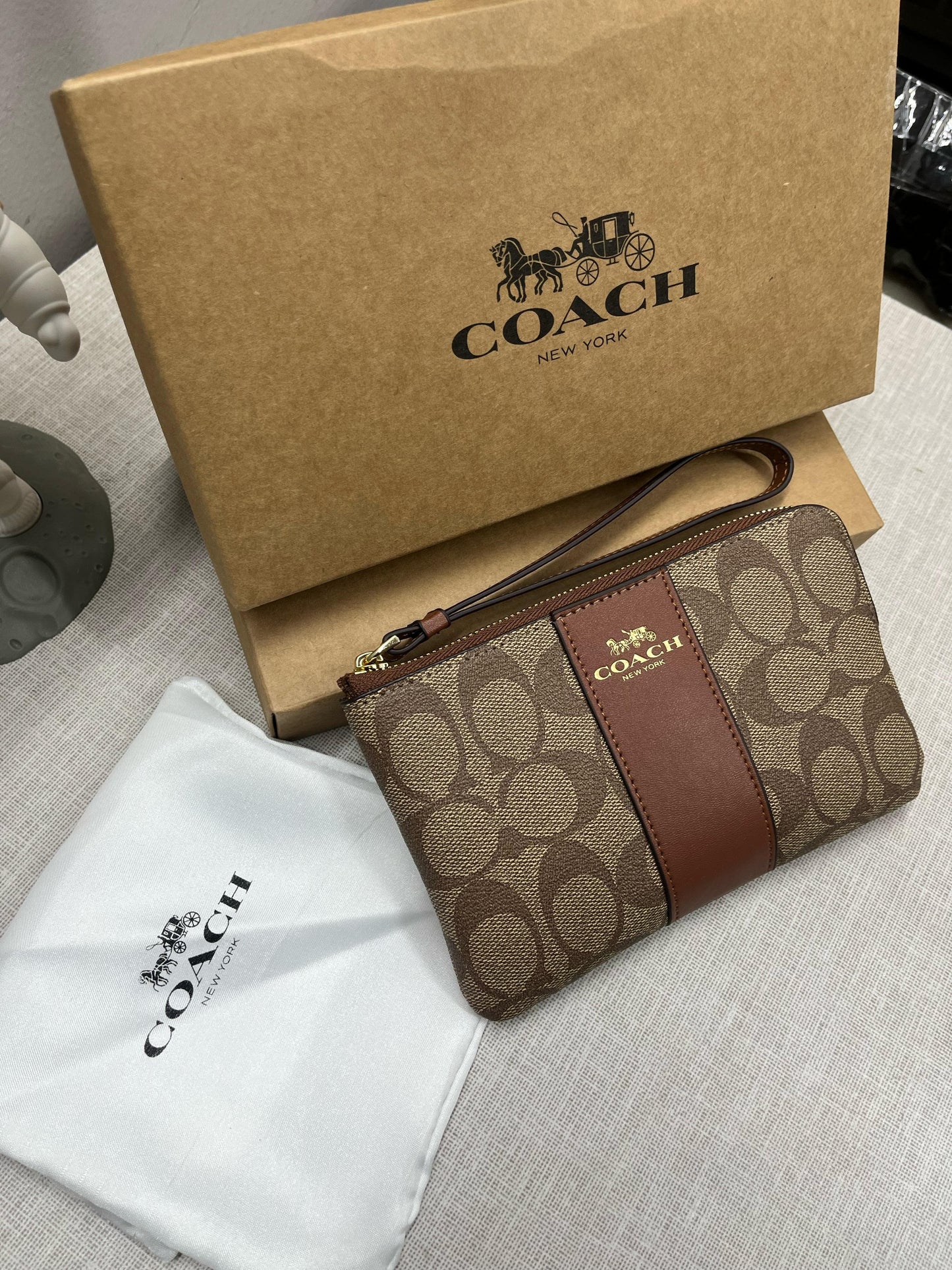 Coach Corner Zip Wristlet In Signature Canvas