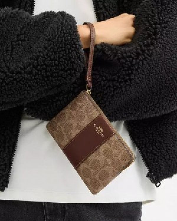 Coach Corner Zip Wristlet In Signature Canvas