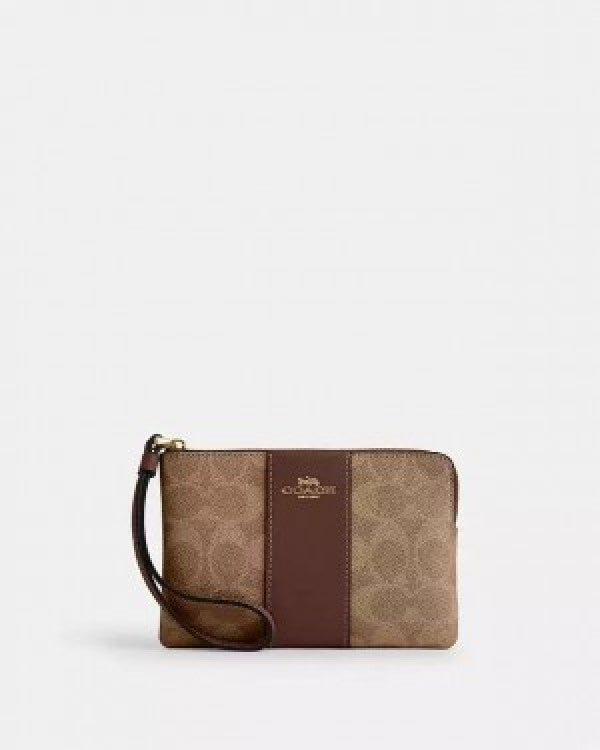 Coach Corner Zip Wristlet In Signature Canvas